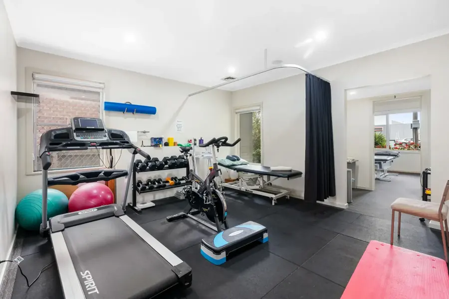 Rehabilitation gym with treadmill, exercise bike and weights